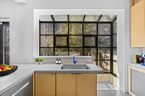 a kitchen with a sink and a window