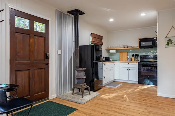 a kitchen with a stove and a microwave