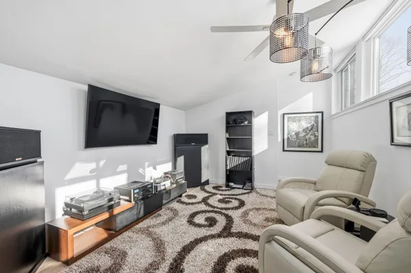 a living room with furniture fireplace and a flat screen tv
