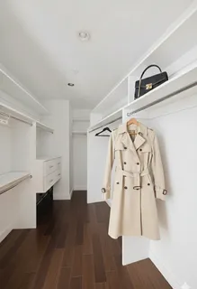 wooden floor with view of entryway