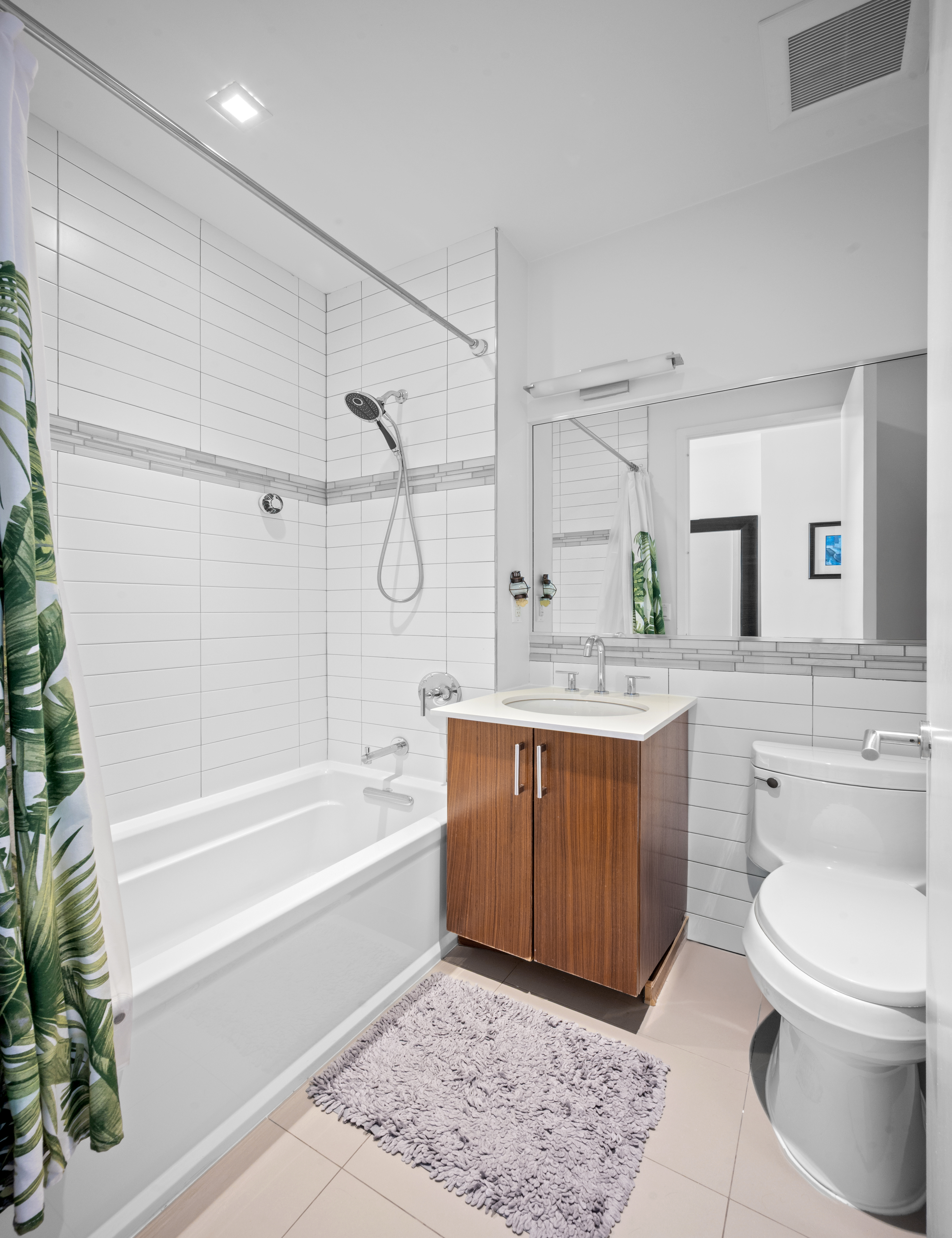 5-41 47th Road, Unit 2B Queens, NY 11101 - Photo 7 of 10 a spacious bathroom with a tub sink toilet and a shower