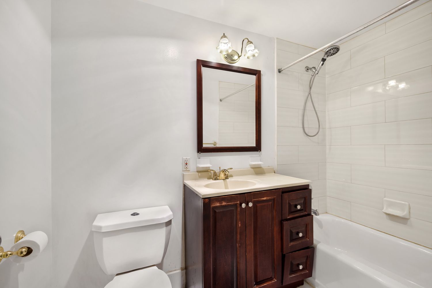 2560 Frederick Douglass Boulevard, Unit D Manhattan, NY 10030 - Photo 11 of 12 a bathroom with a sink toilet vanity and shower