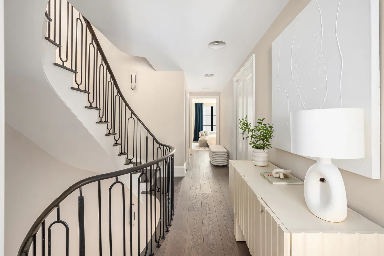 a bedroom with bed and a large window