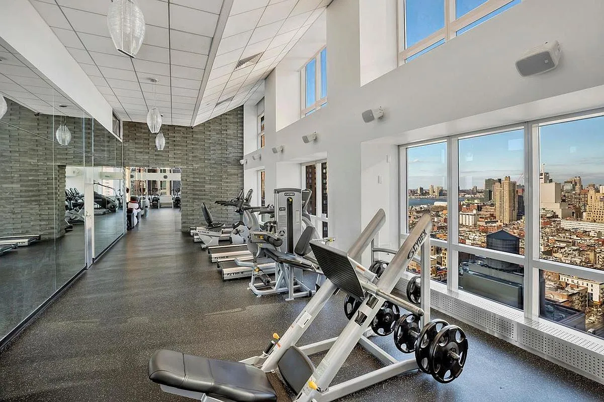 350 West 42nd Street, Unit 8H Manhattan, NY 10036 - Photo 8 of 11 a view of a room with gym equipment