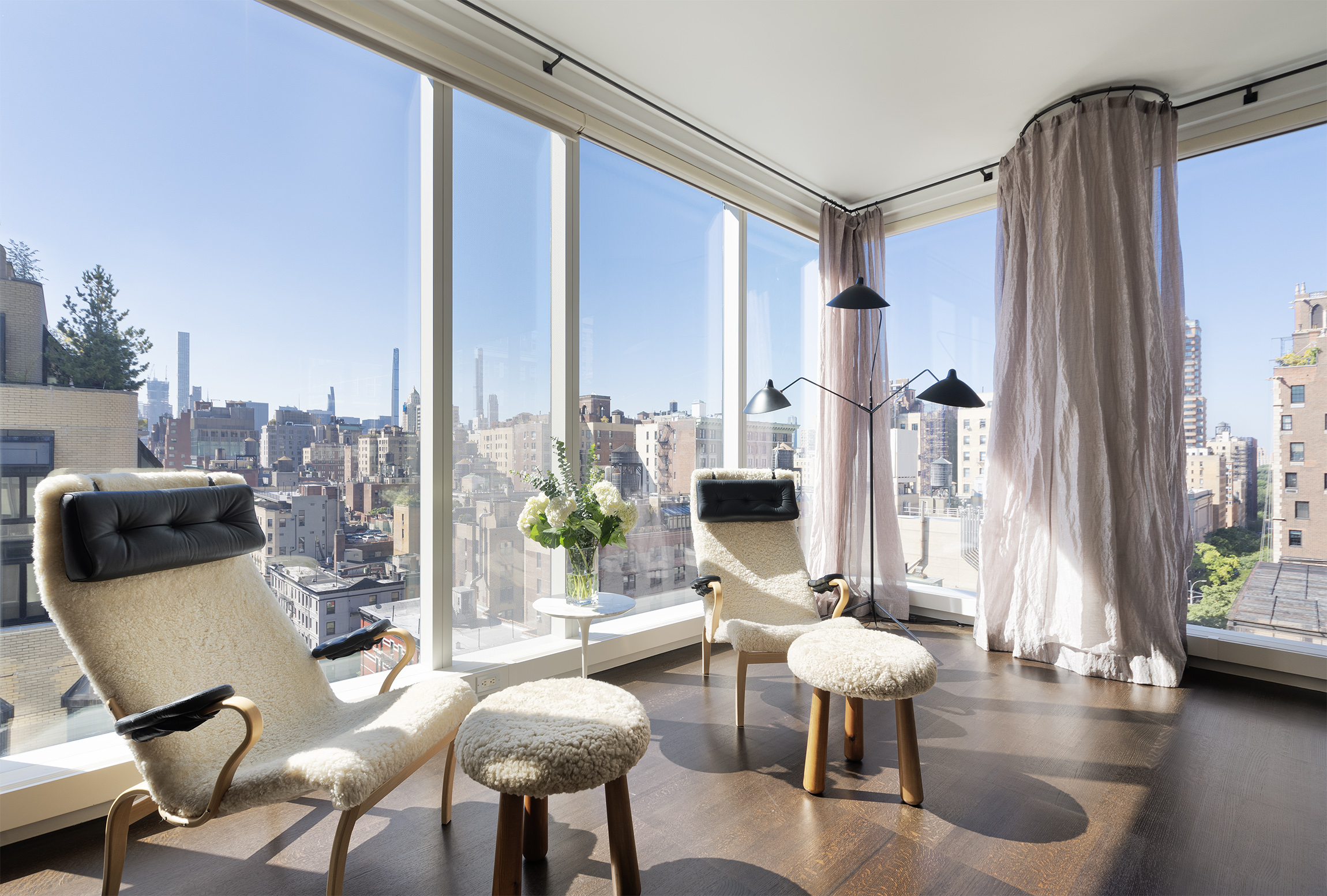 151 East 85th Street, Unit 14A Manhattan, NY 10028 - Photo 6 of 14 a living room with furniture and a large window
