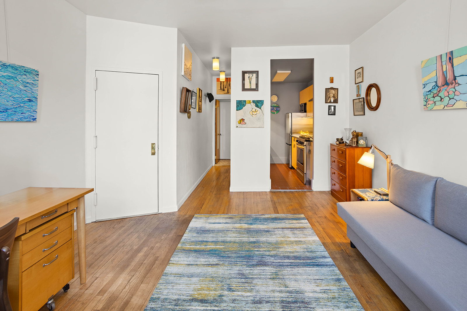 285 5th Avenue, Unit 2B Brooklyn, NY 11215 - Photo 2 of 6 a hallway with wooden floor and furniture