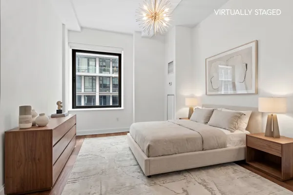 a bedroom with a bed and a couch