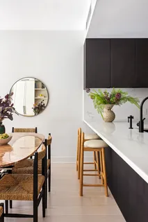 a kitchen with stainless steel appliances a stove a sink a refrigerator and cabinets