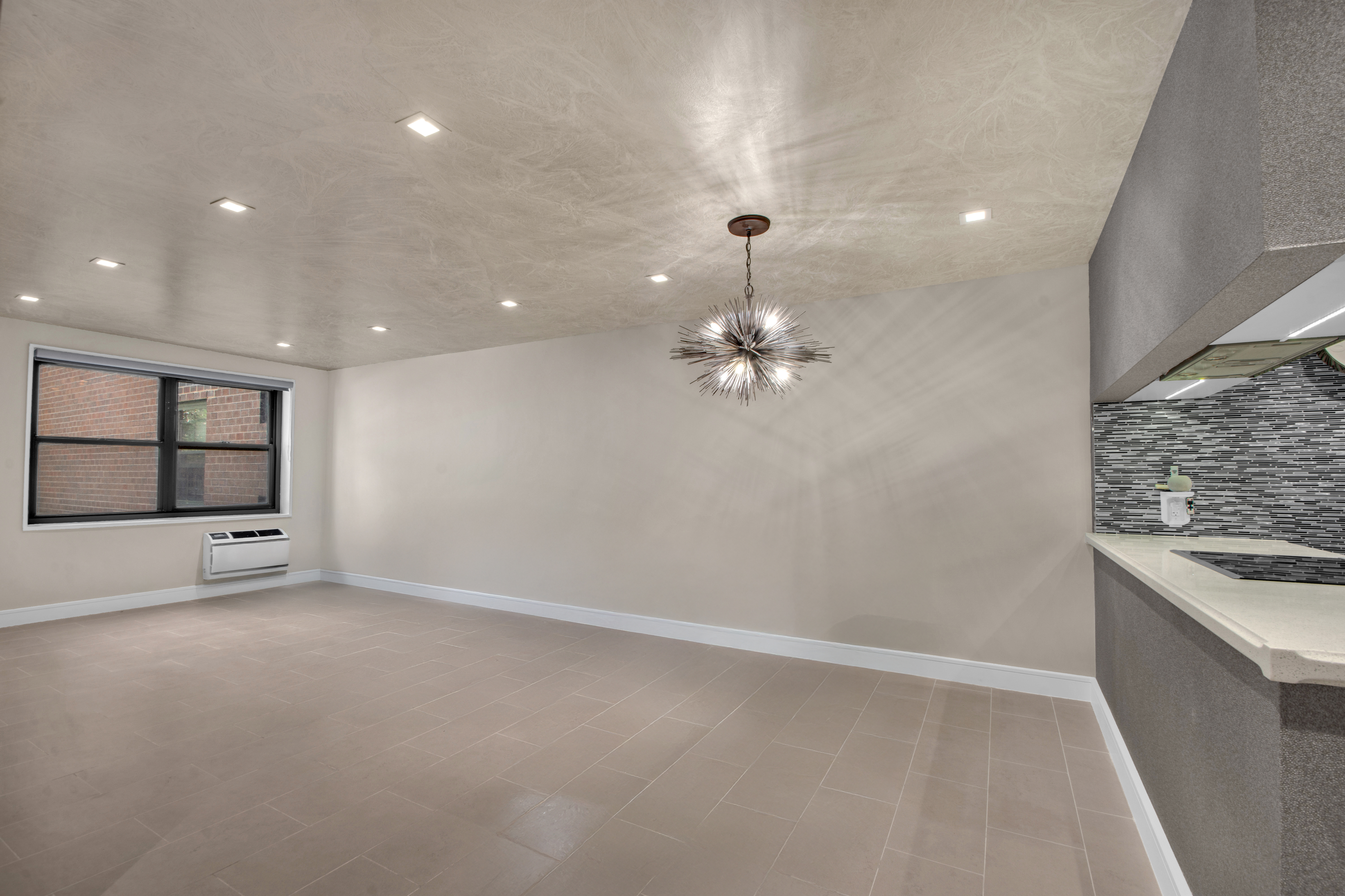 690 Washington Street, Unit 1A Manhattan, NY 10014 - Photo 2 of 17 wooden floor in an empty room with a window