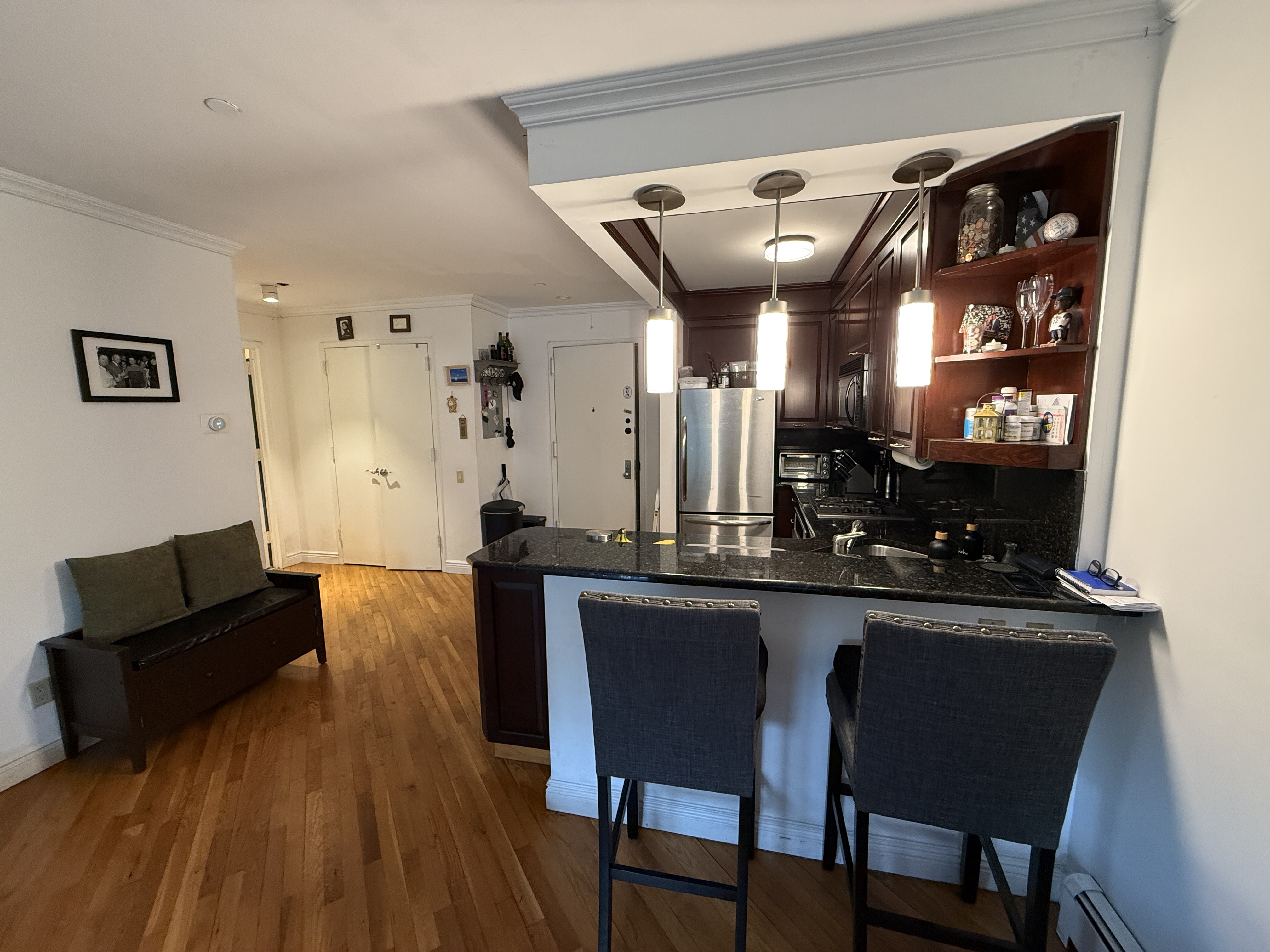 101 Prospect Park Southwest, Unit 3B Brooklyn, NY 11218 - Photo 16 of 23 a living room with furniture and wooden floor