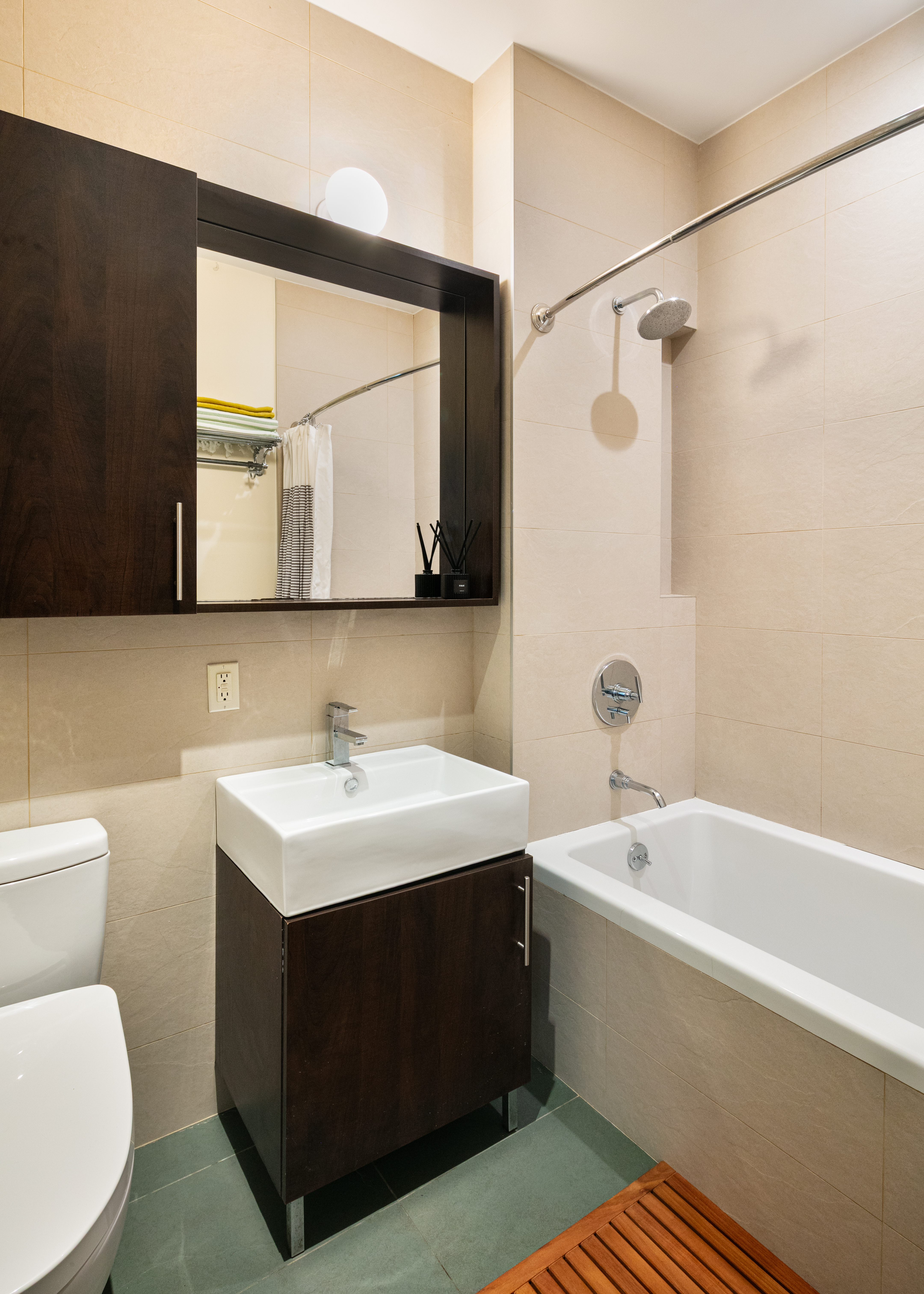 111 Monroe Street, Unit 4B Brooklyn, NY 11216 - Photo 6 of 8 a bathroom with a sink a toilet and a bathtub