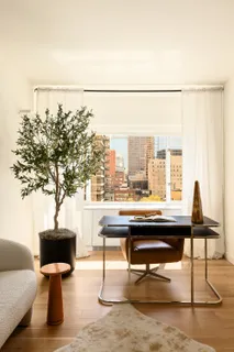 a view of a living room and chandelier