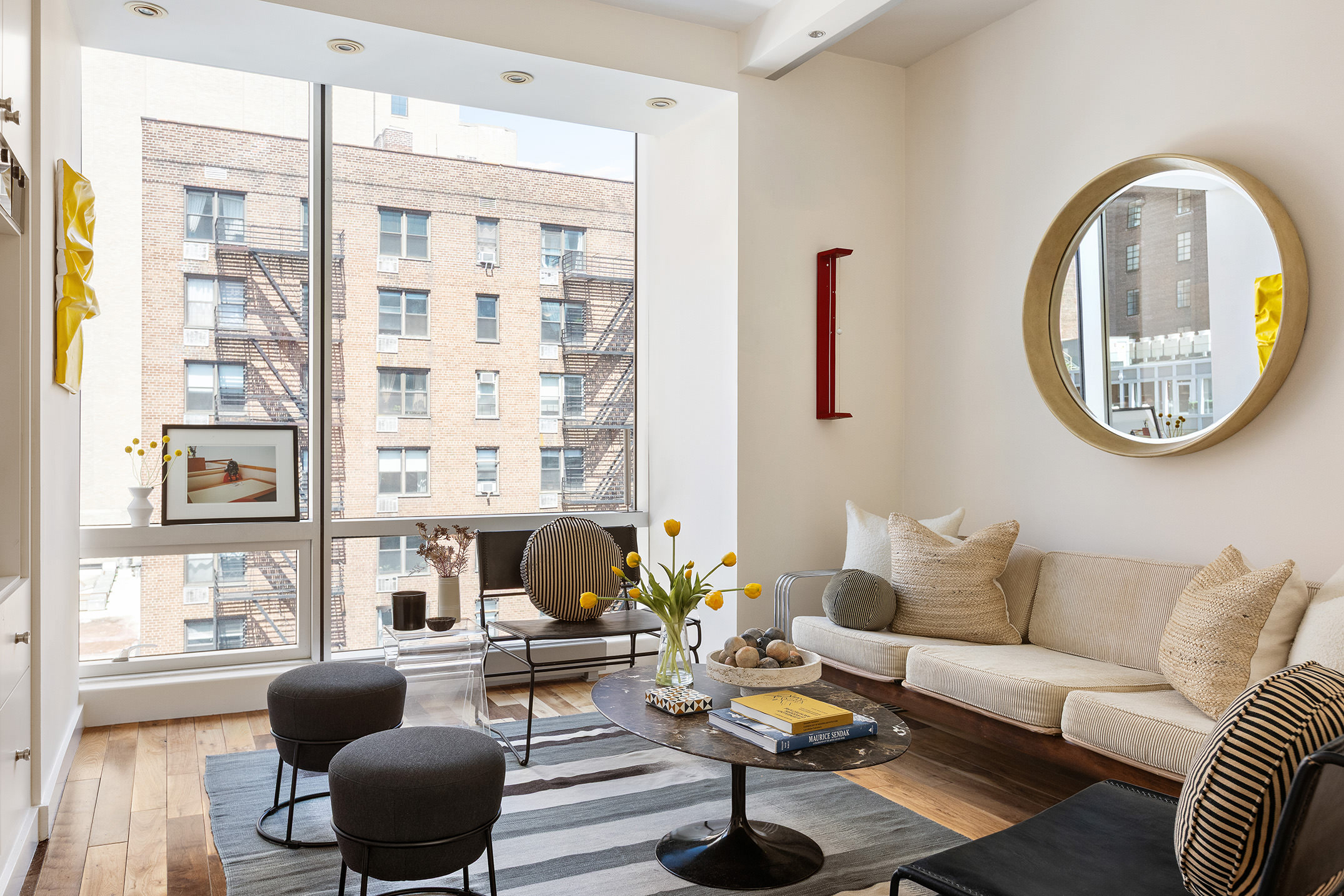 166 West 18th Street, Unit 4A Manhattan, NY 10011 - Photo 2 of 14 a living room with furniture and a large window