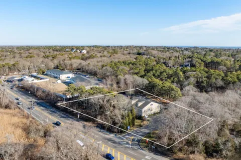 a view of a car park in front of house