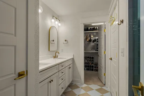 a bathroom with a double vanity sink a and a mirror