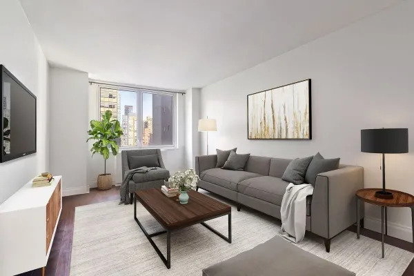 a living room with furniture and a flat screen tv