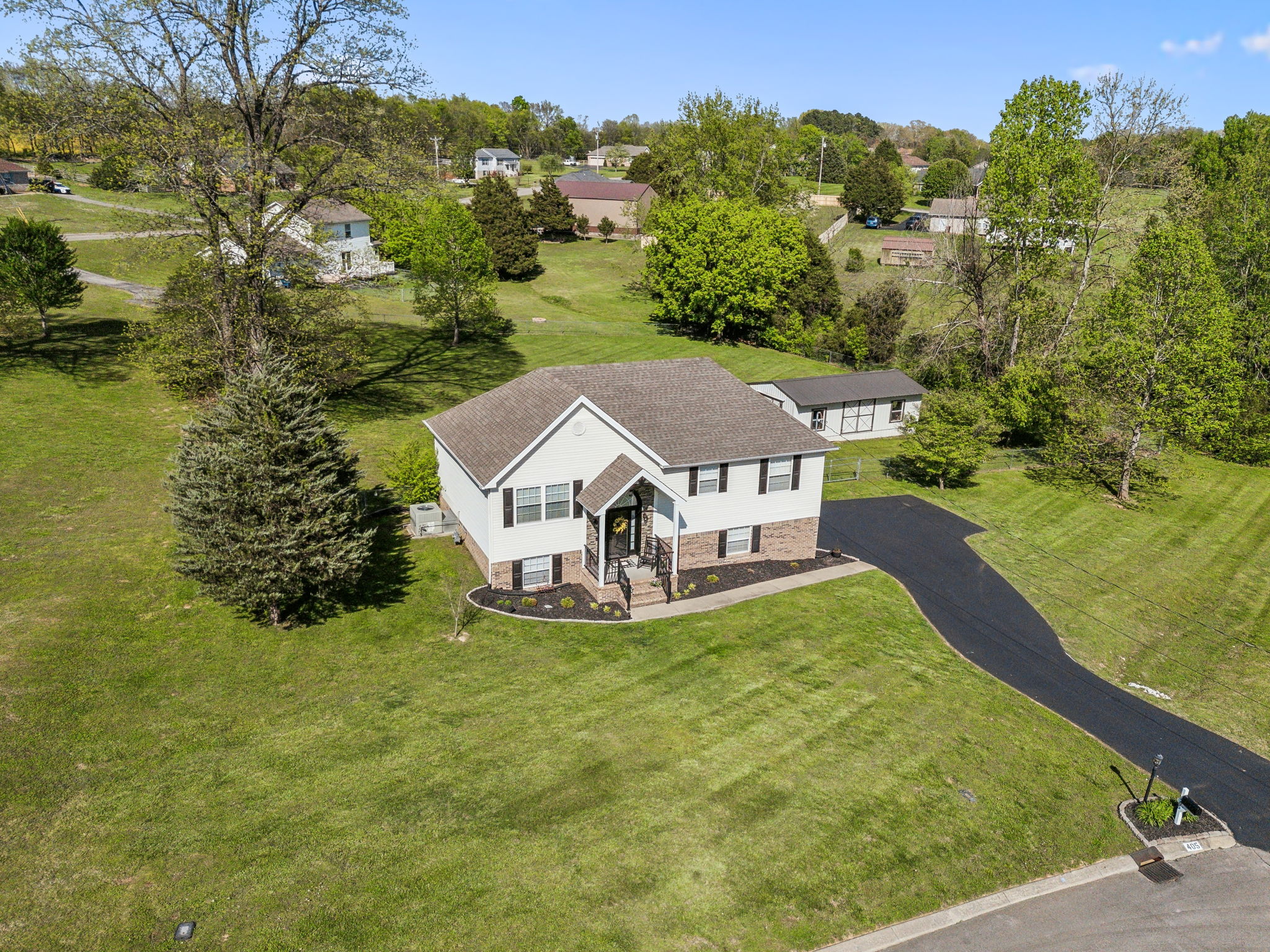 405 Billy Lane Spring Hill, TN 37174 - Photo 2 of 39 an aerial view of a house with yard swimming pool and green space