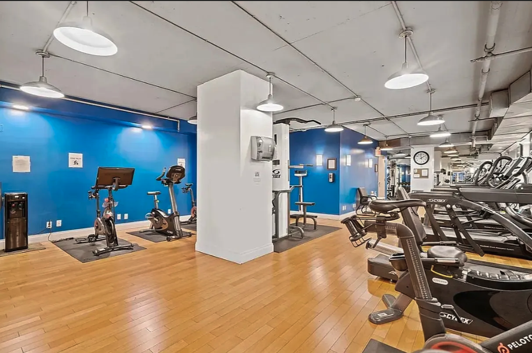 E 47th St, Unit 10H Manhattan, NY 10017 - Photo 6 of 10 a view of a room with gym equipment