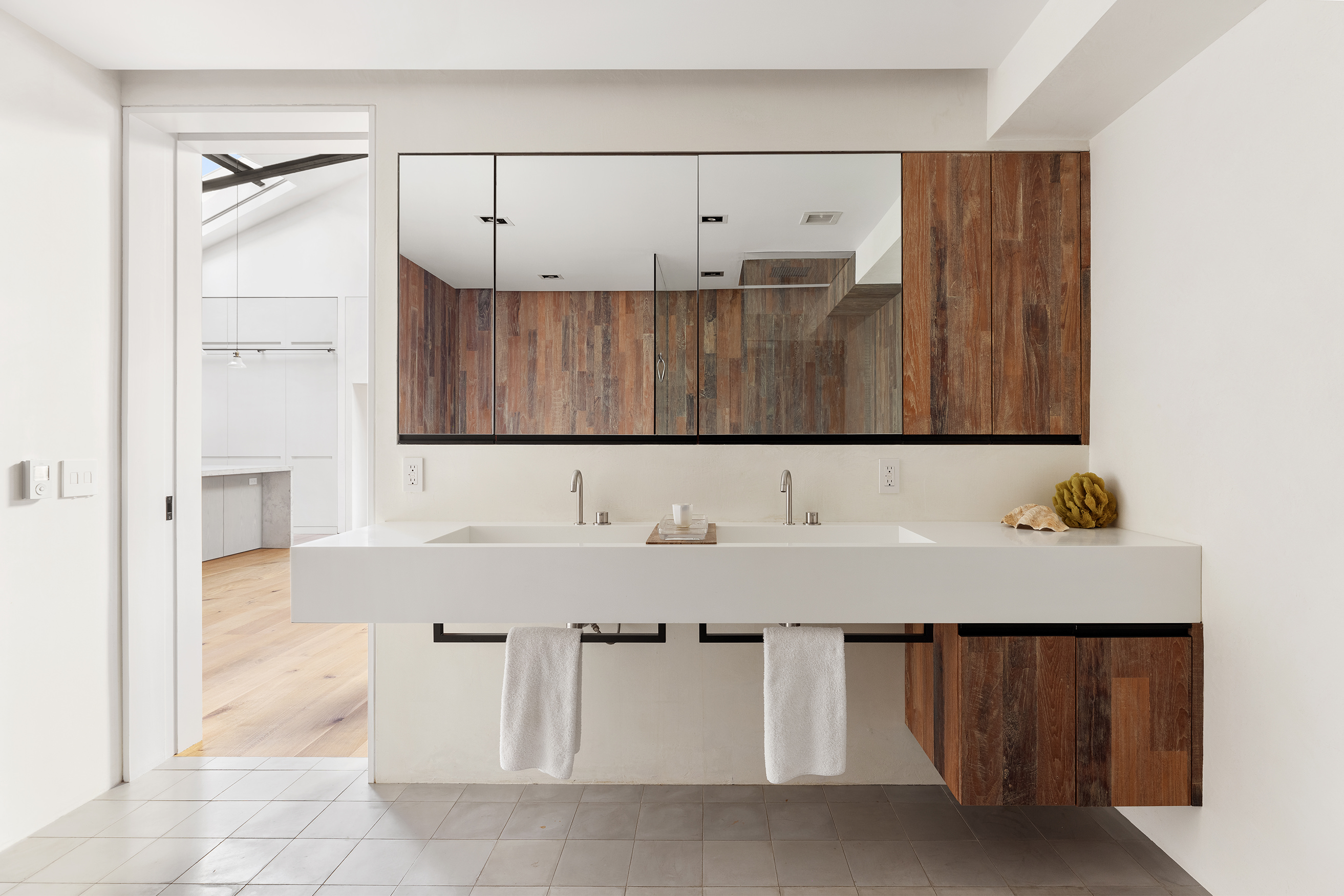240 Centre Street, Unit 6N Manhattan, NY 10013 - Photo 10 of 16 a bathroom with a sink and a mirror