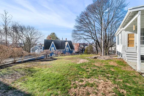 a view of a house with a yard