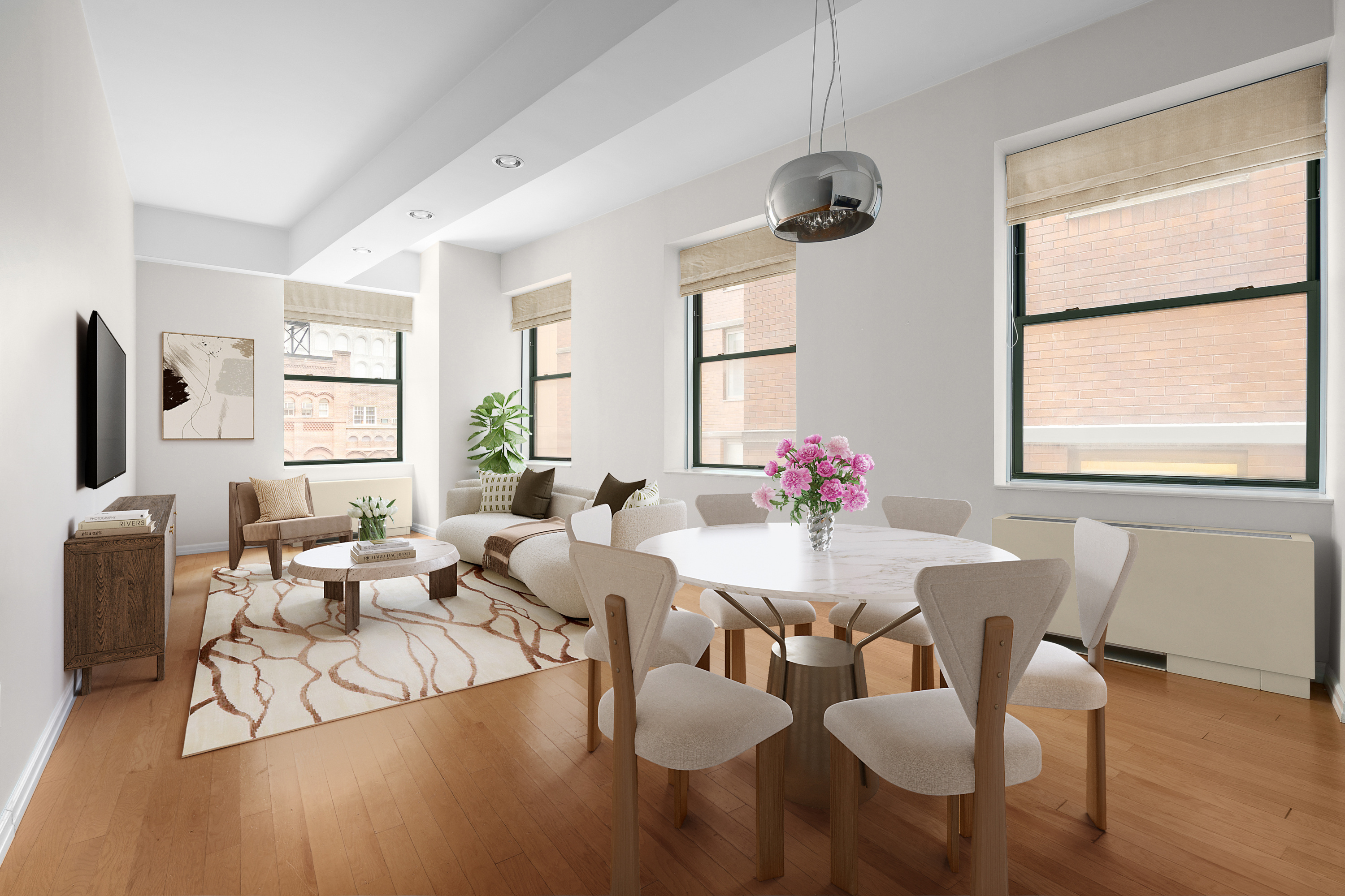 a view of a dining room with furniture window and wooden floor