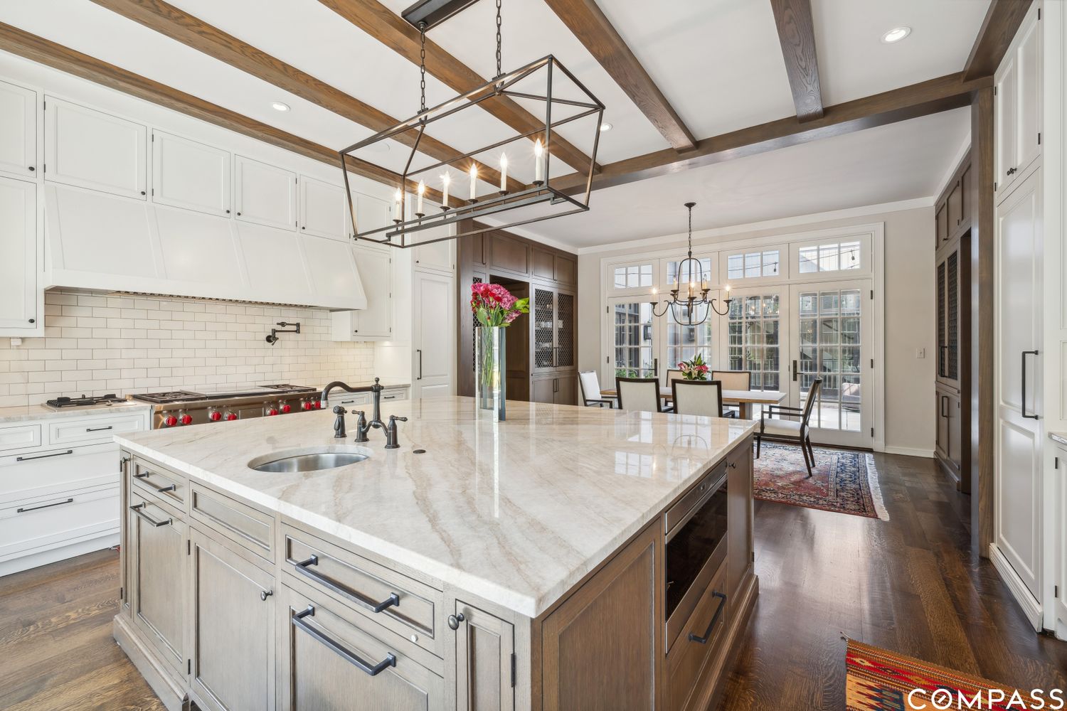 a kitchen with stainless steel appliances granite countertop a sink a oven and a counter space
