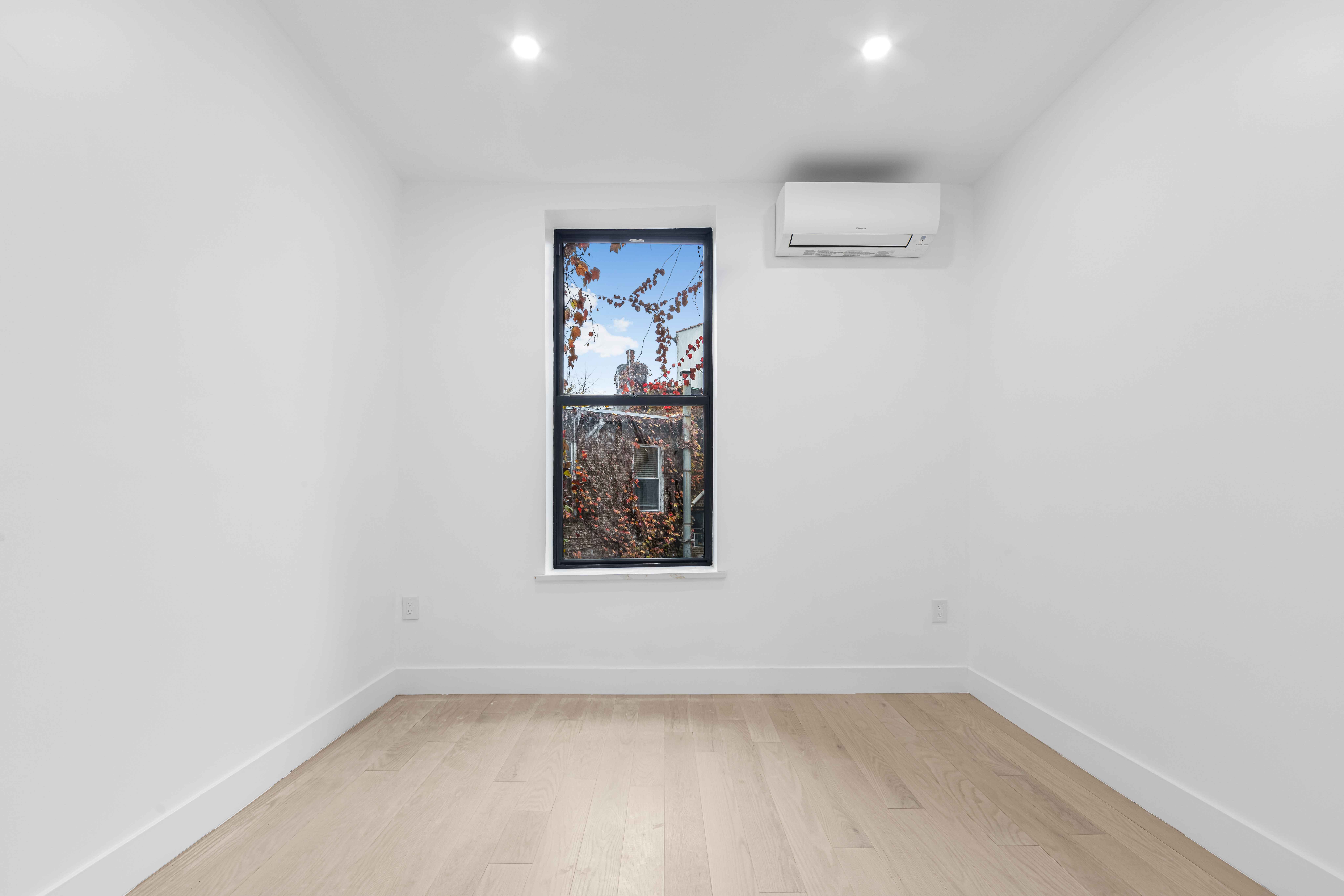 204 Flatbush Avenue, Unit 2L Brooklyn, NY 11217 - Photo 5 of 9 a view of a hallway with window