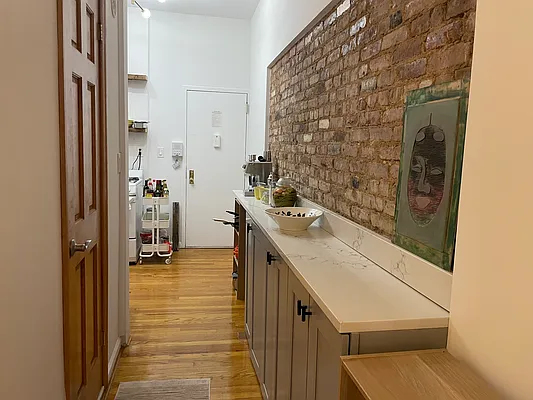 314 East 11th Street, Unit 3A Manhattan, NY 10003 - Photo 3 of 6 a bathroom with a sink and a mirror