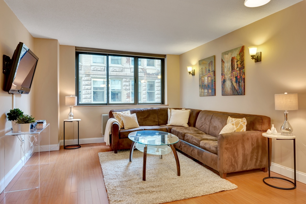 280 Park Avenue South, Unit 4D Manhattan, NY 10010 - Photo 1 of 13 a living room with furniture and a flat screen tv