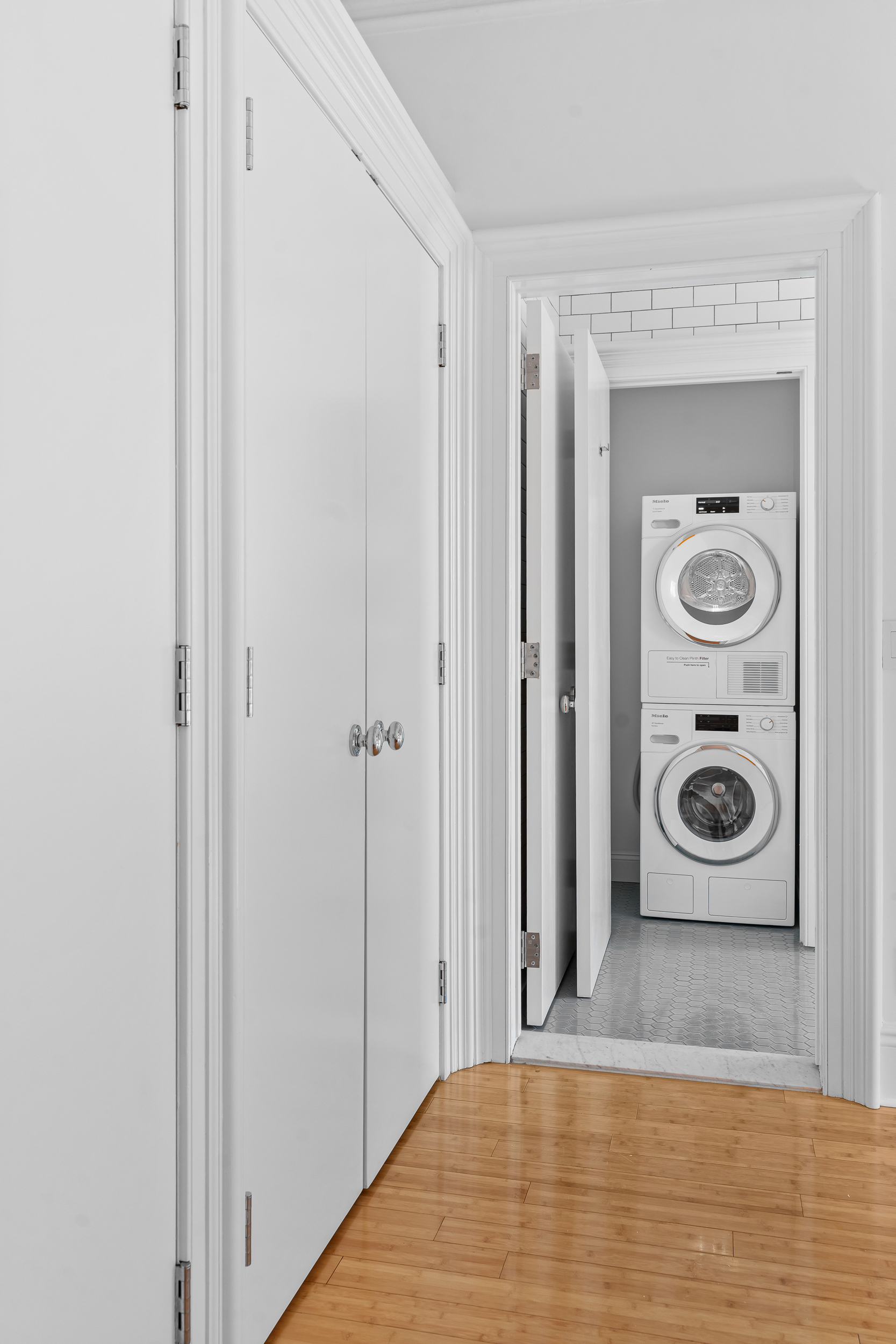 315 Adelphi Street, Unit 2 Brooklyn, NY 11205 - Photo 4 of 12 a view of a hallway with wooden floor and a door