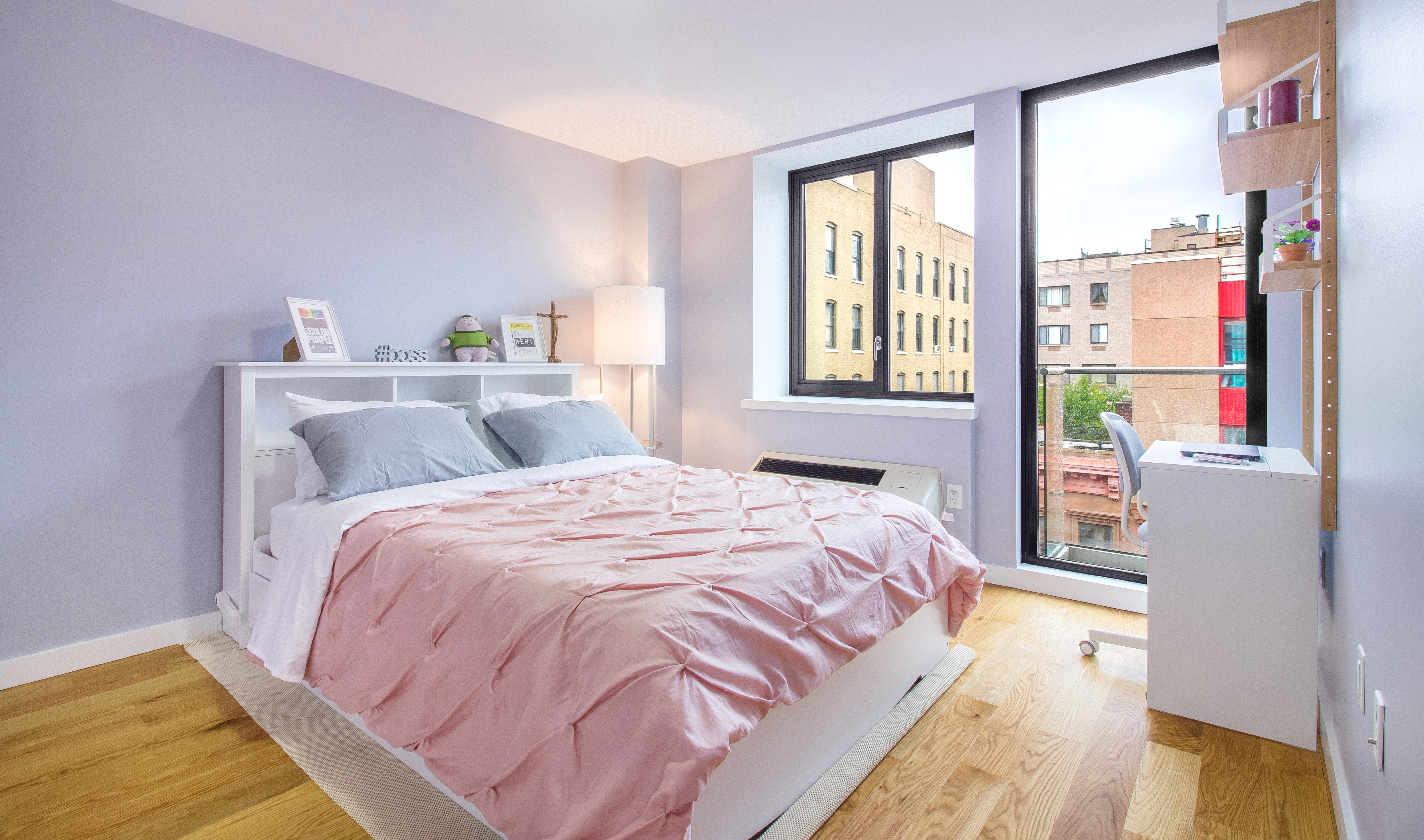 51 East 131st Street, Unit 6A Manhattan, NY 10037 - Photo 10 of 12 a bedroom with a bed and a window