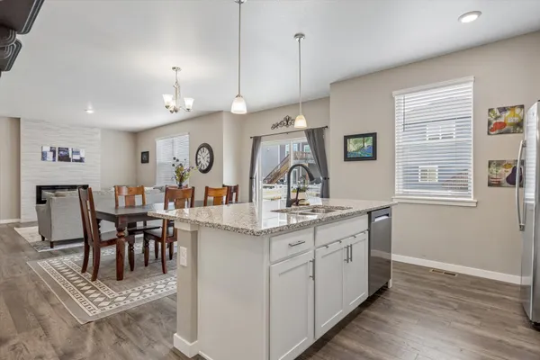 a view of dining table chairs and window