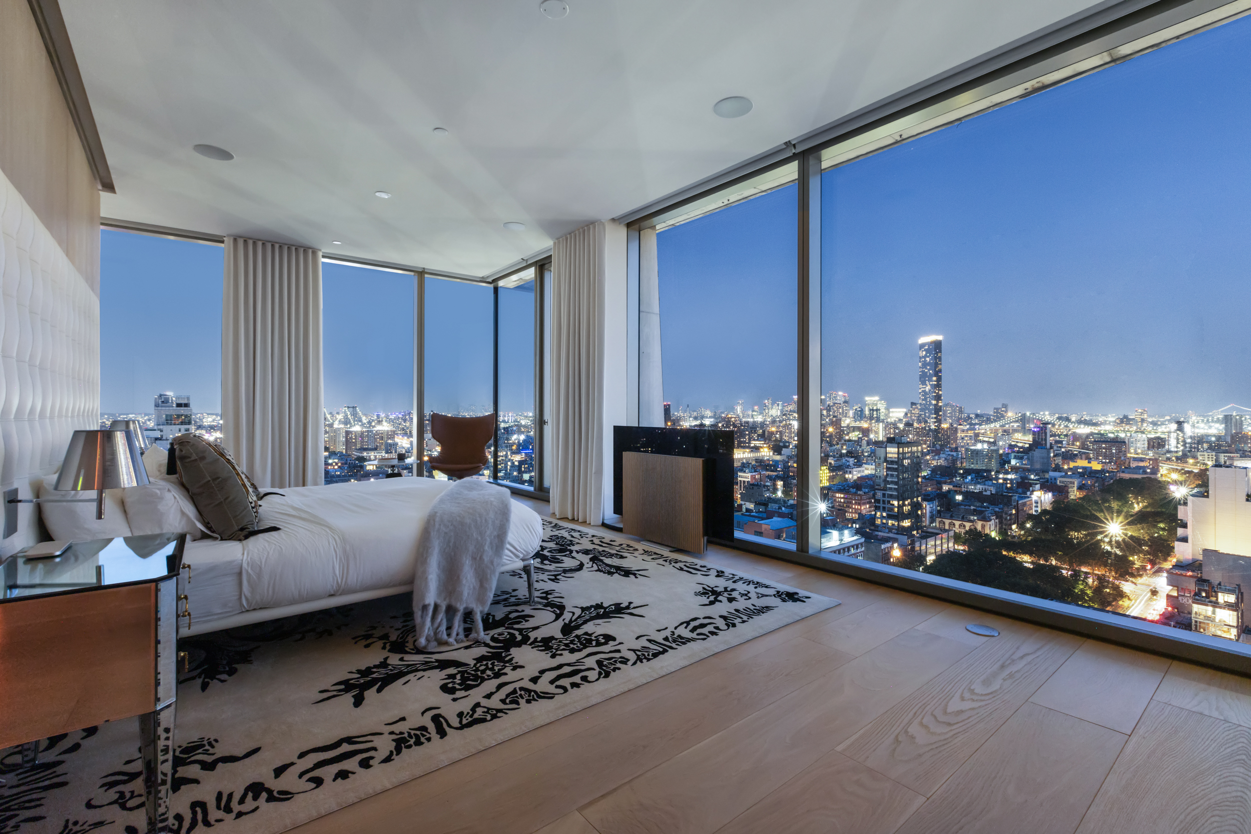 215 Chrystie Street, Unit PH2 Manhattan, NY 10002 - Photo 16 of 30 a living room with furniture and a table