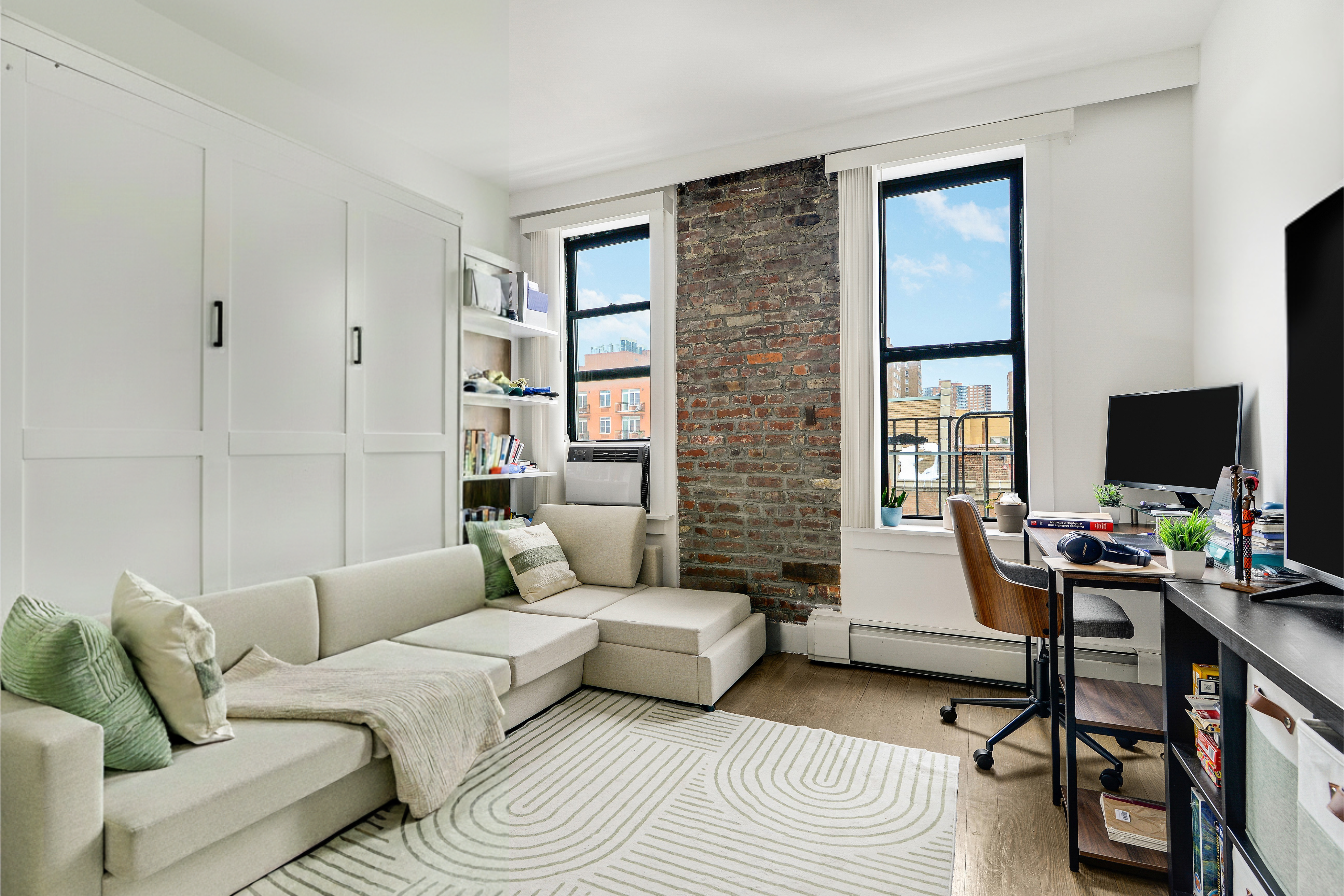 48 West 138th Street, Unit 6A Manhattan, NY 10037 - Photo 3 of 9 a living room with furniture and a flat screen tv