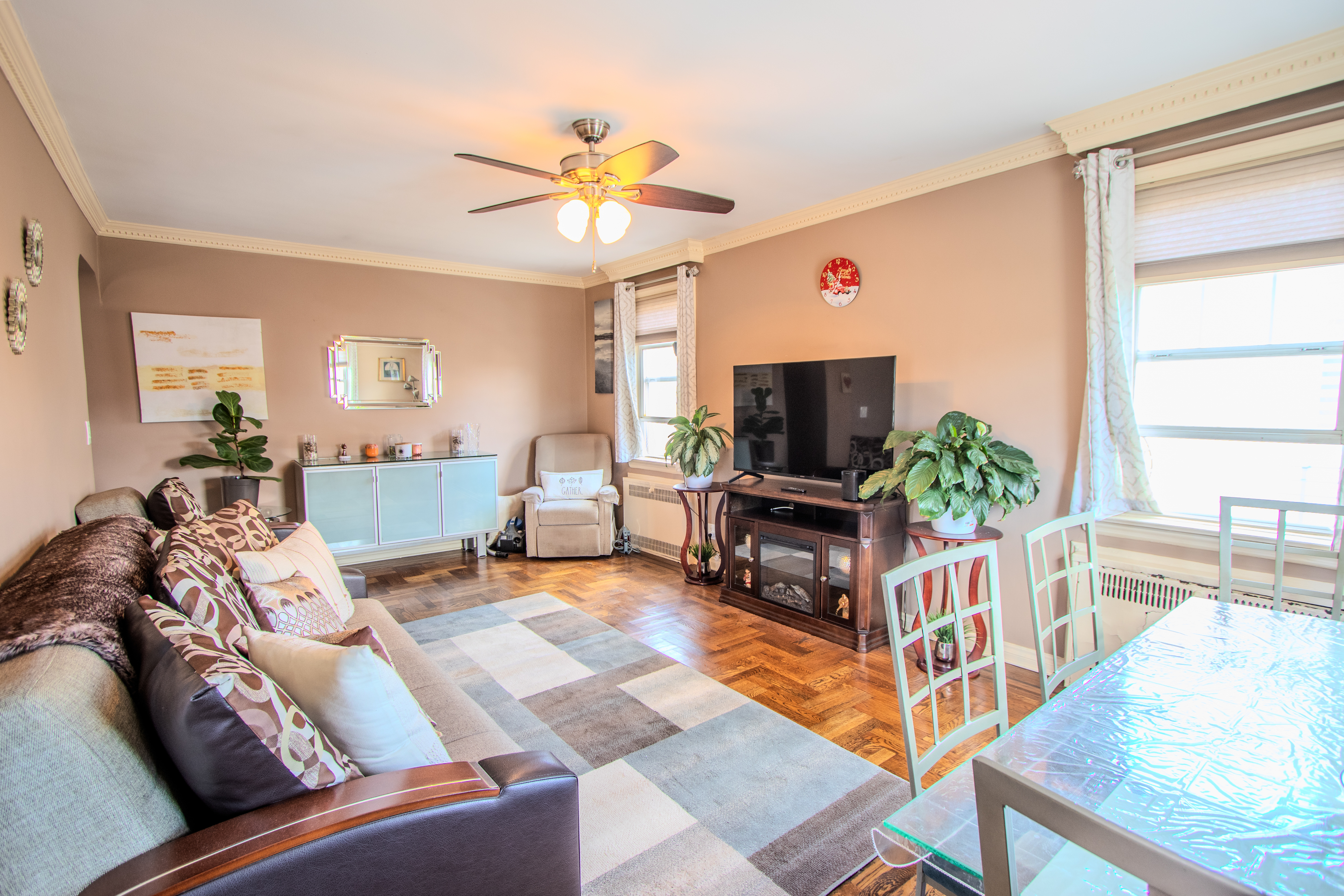 238 West End Avenue Brooklyn, NY 11235 - Photo 6 of 13 a living room with furniture and a flat screen tv