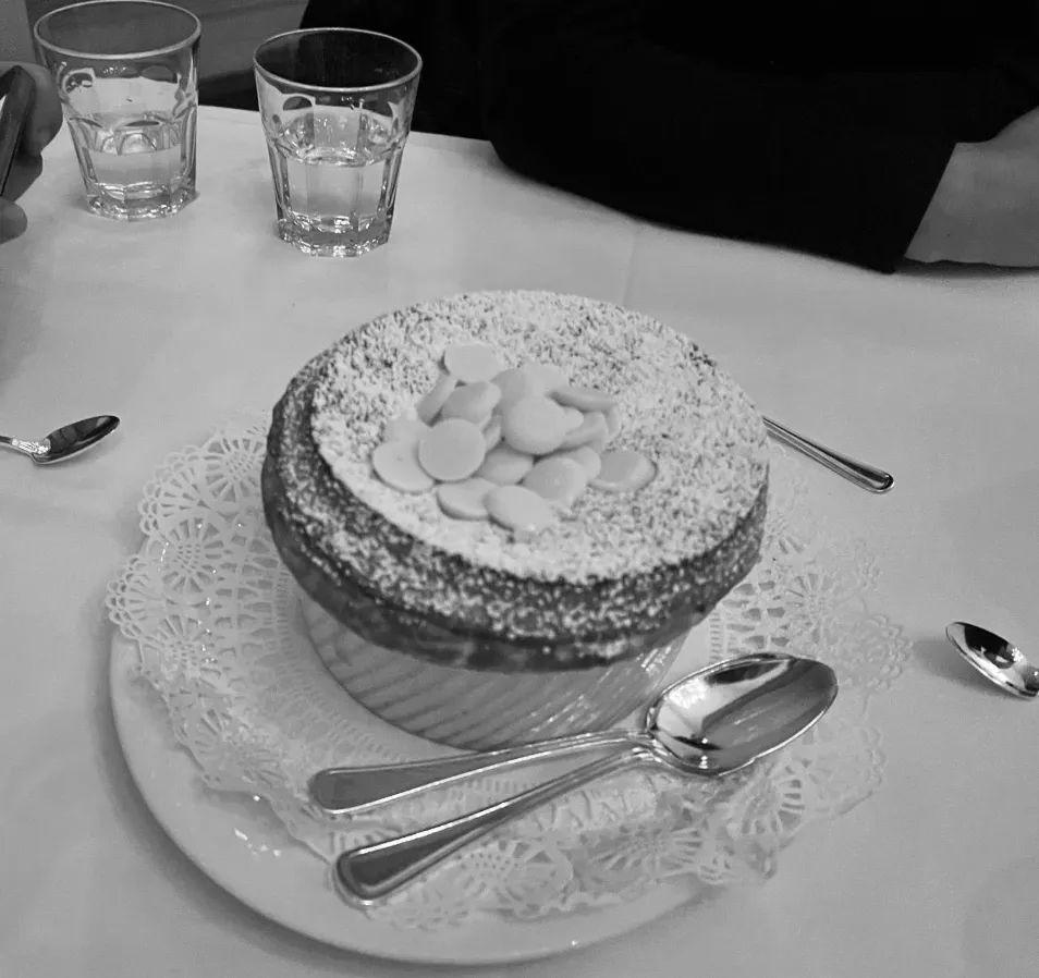 a bathroom with a mirror and vanity