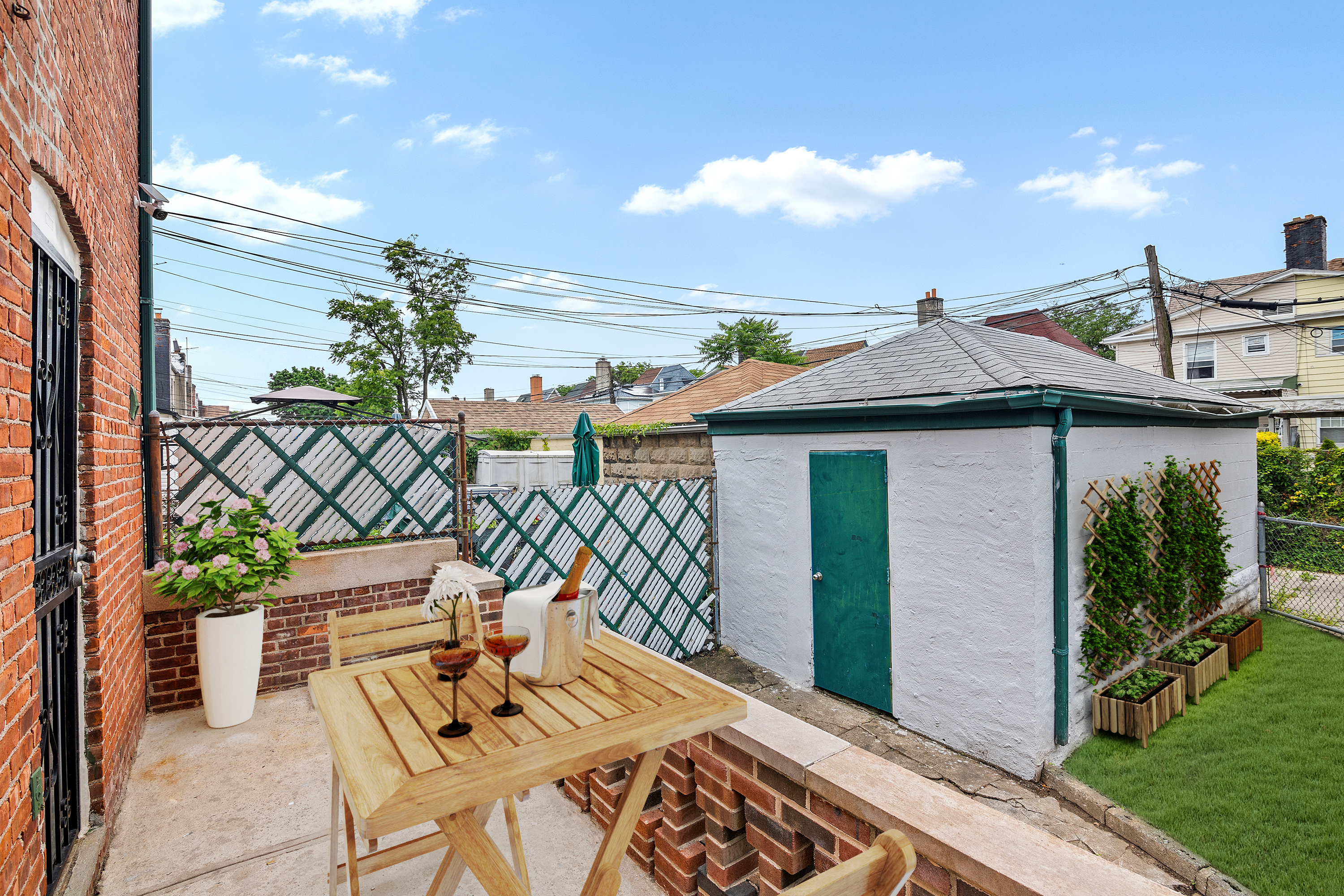 806 East 48th Street Brooklyn, NY 11203 - Photo 9 of 13 a view of a patio with table and chairs and potted plants
