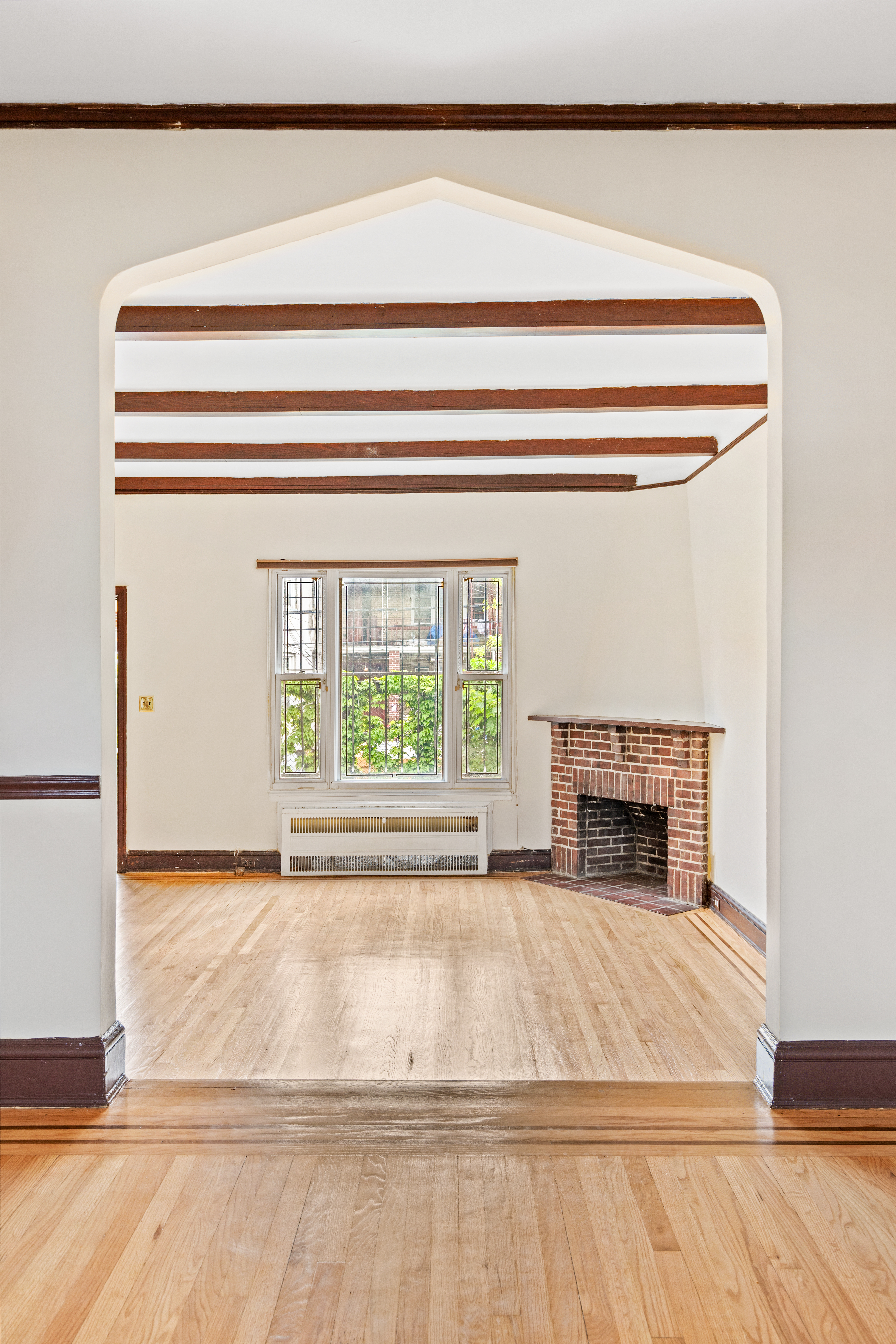 32 Tudor Terrace Brooklyn, NY 11224 - Photo 3 of 15 a view of empty room with wooden floor and a window