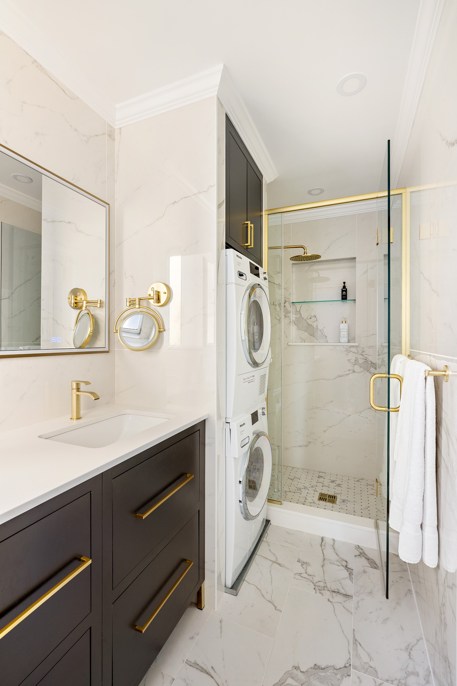 875 5th Avenue, Unit 8D Manhattan, NY 10065 - Photo 9 of 13 a bathroom with a sink and a mirror
