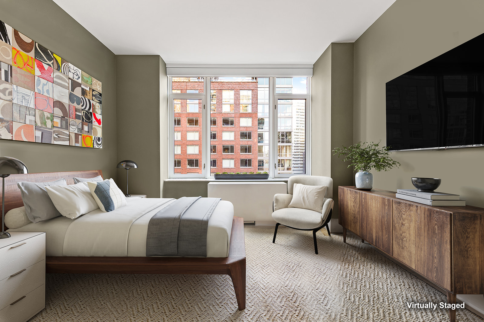 210 Warren Street, Unit 10G Manhattan, NY 10282 - Photo 10 of 15 a bedroom with a bed and a flat screen tv