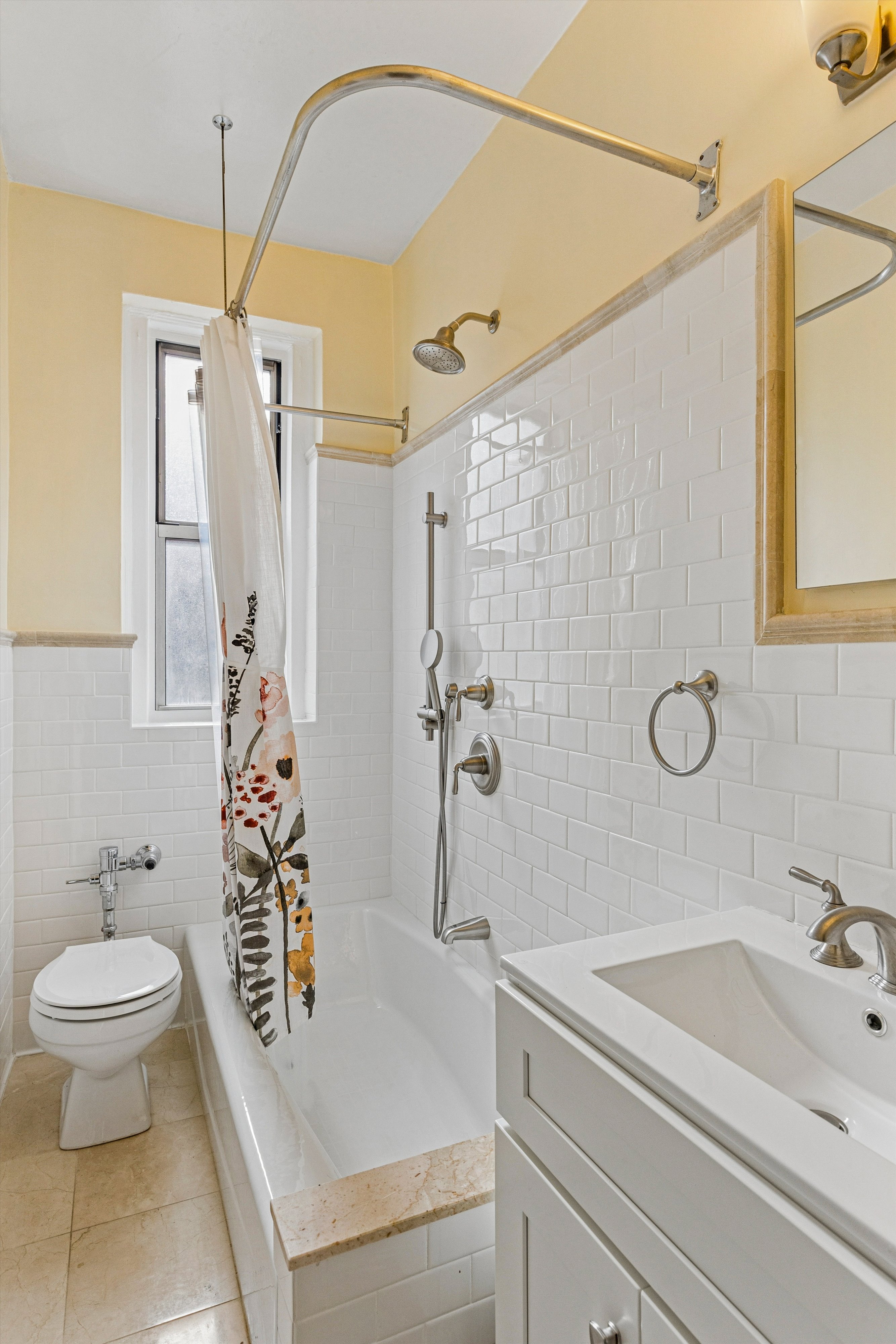 680 West 204th Street, Unit 4F Manhattan, NY 10034 - Photo 9 of 21 a bathroom with a sink a toilet and shower curtain
