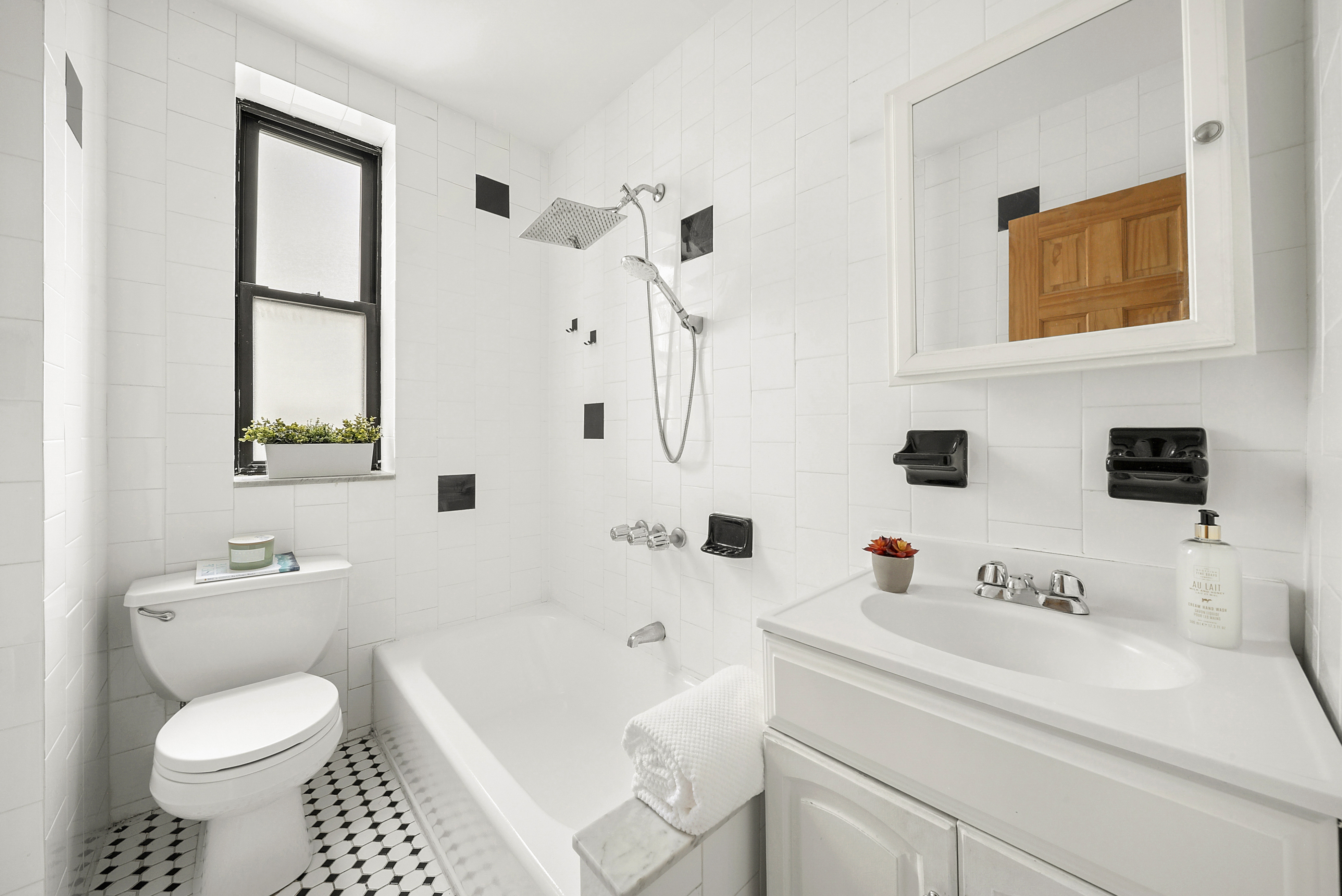 325 Marine Avenue, Unit D10 Brooklyn, NY 11209 - Photo 4 of 5 a bathroom with a sink a toilet and a bathtub