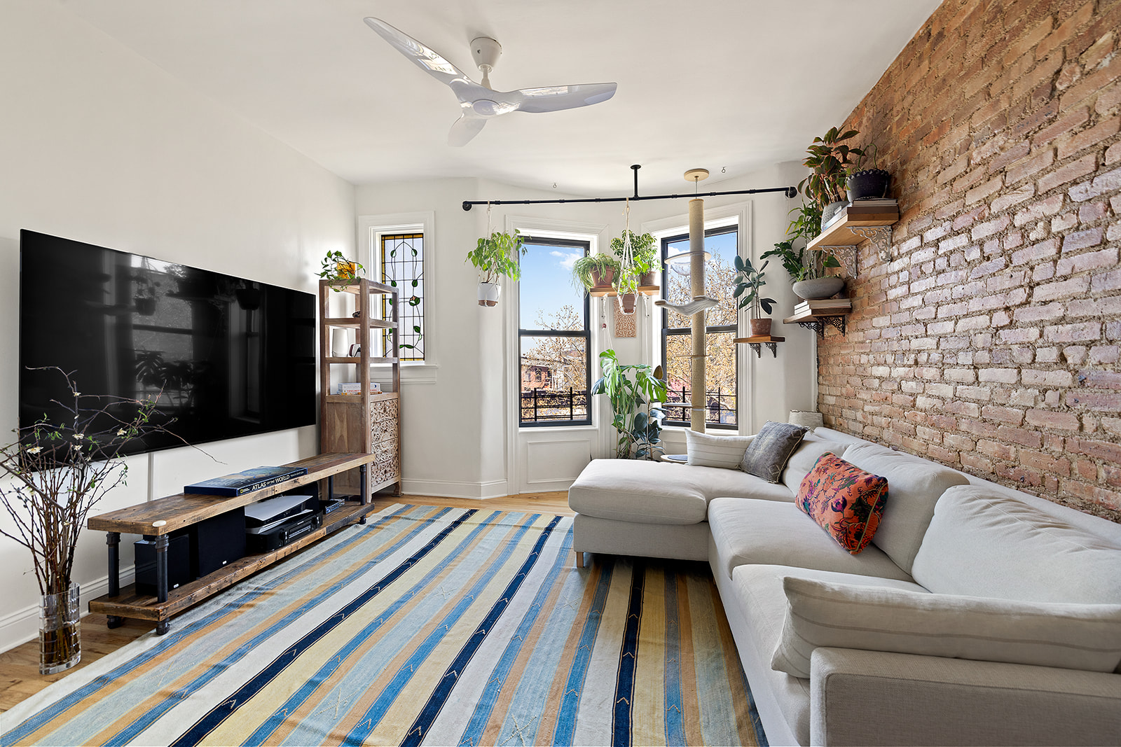 114 Garfield Place, Unit 4L Brooklyn, NY 11215 - Photo 1 of 11 a living room with furniture and a flat screen tv