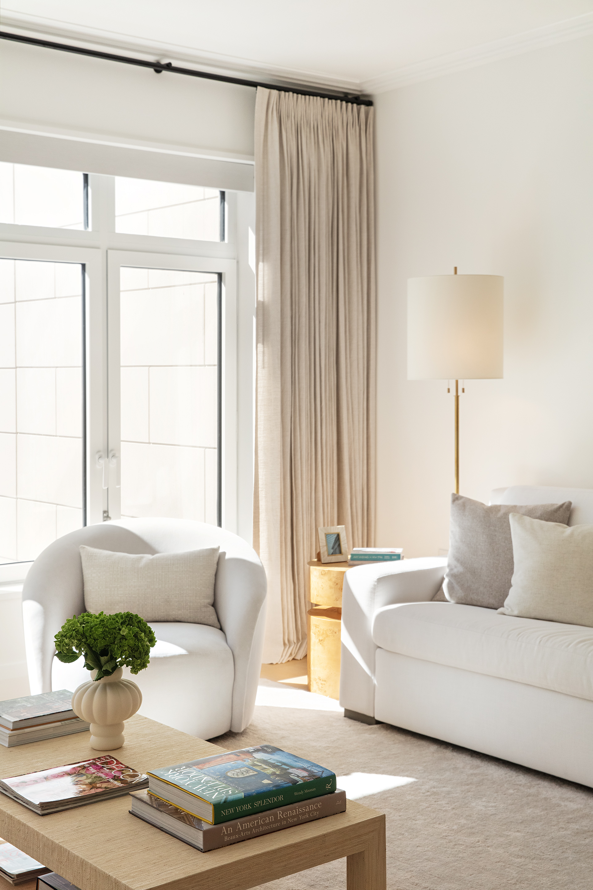 200 East 83rd Street, Unit 4A Manhattan, NY 10028 - Photo 3 of 26 a living room with furniture and a potted plant