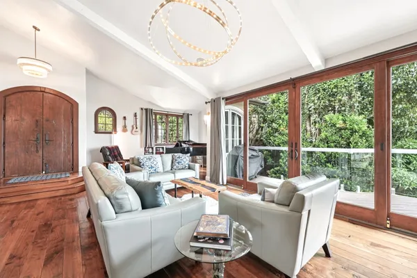 a living room with furniture and a large window