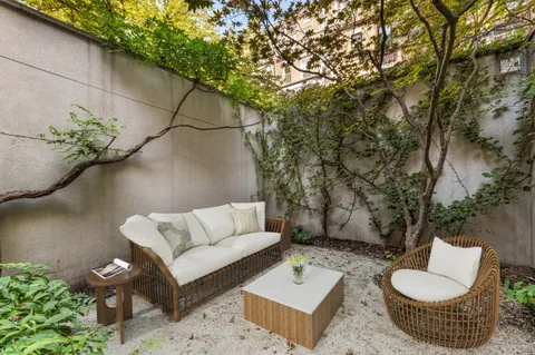 a outdoor living space with furniture and a couch