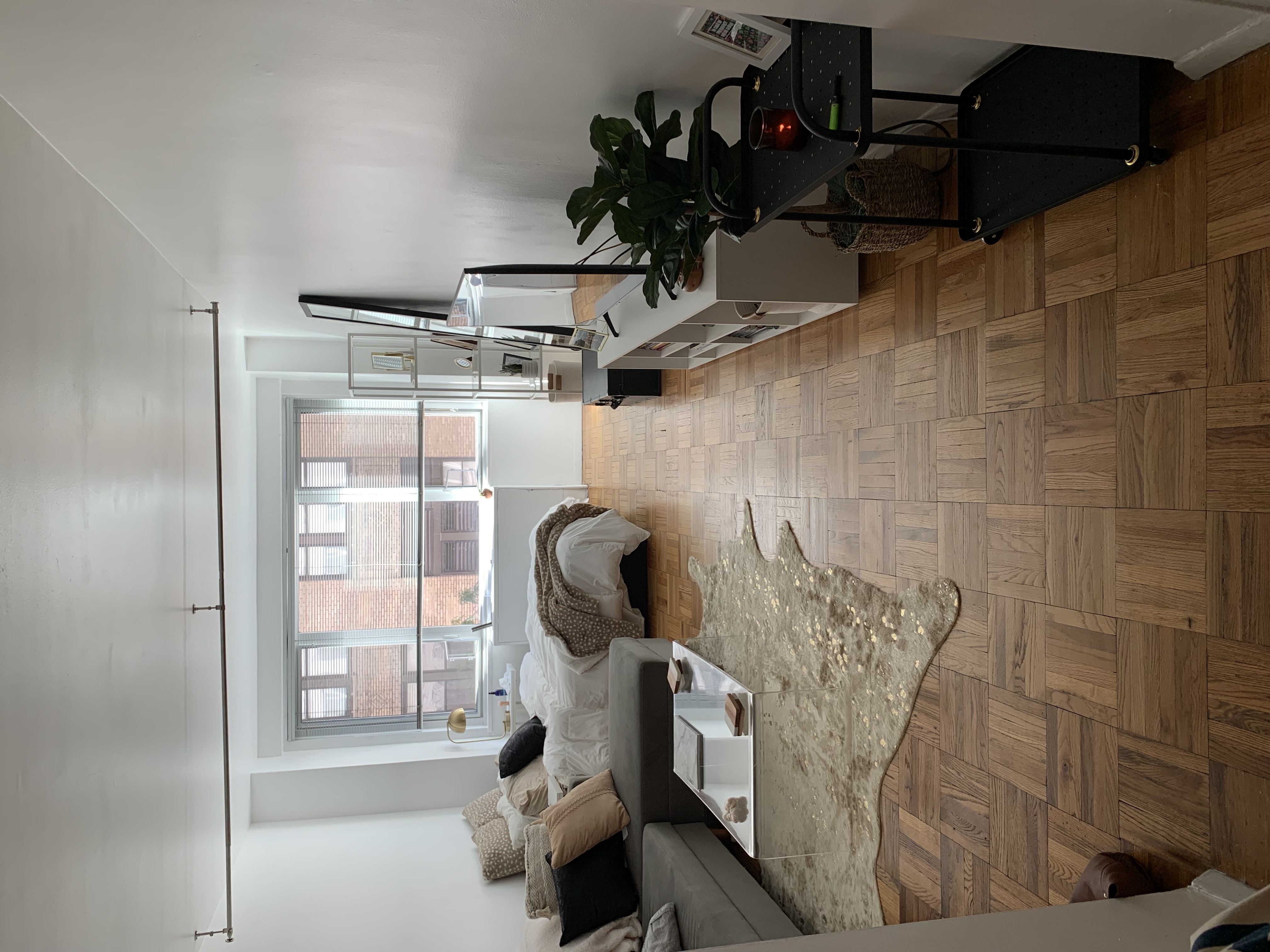 a bedroom with furniture and a window