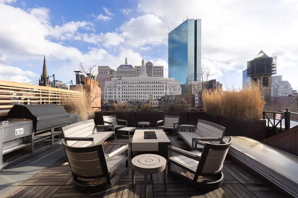 a view of a terrace with furniture and stove