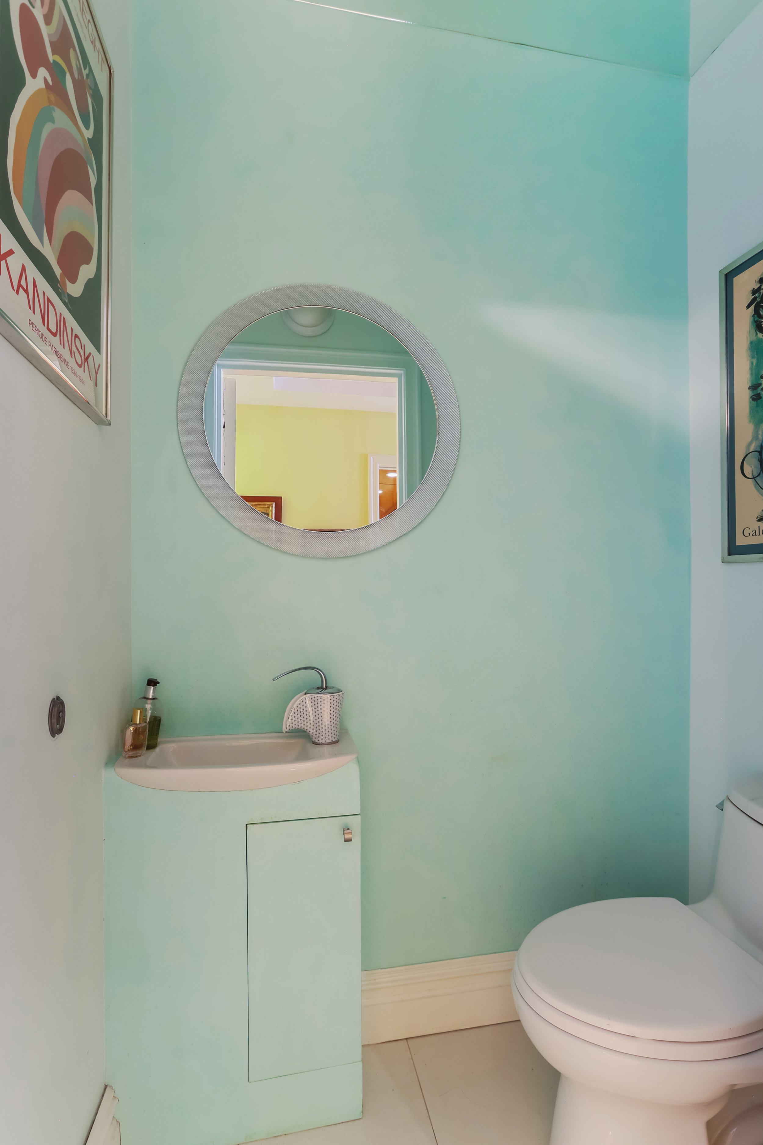 465 Park Avenue, Unit 409 Manhattan, NY 10022 - Photo 6 of 11 a bathroom with a sink toilet and mirror