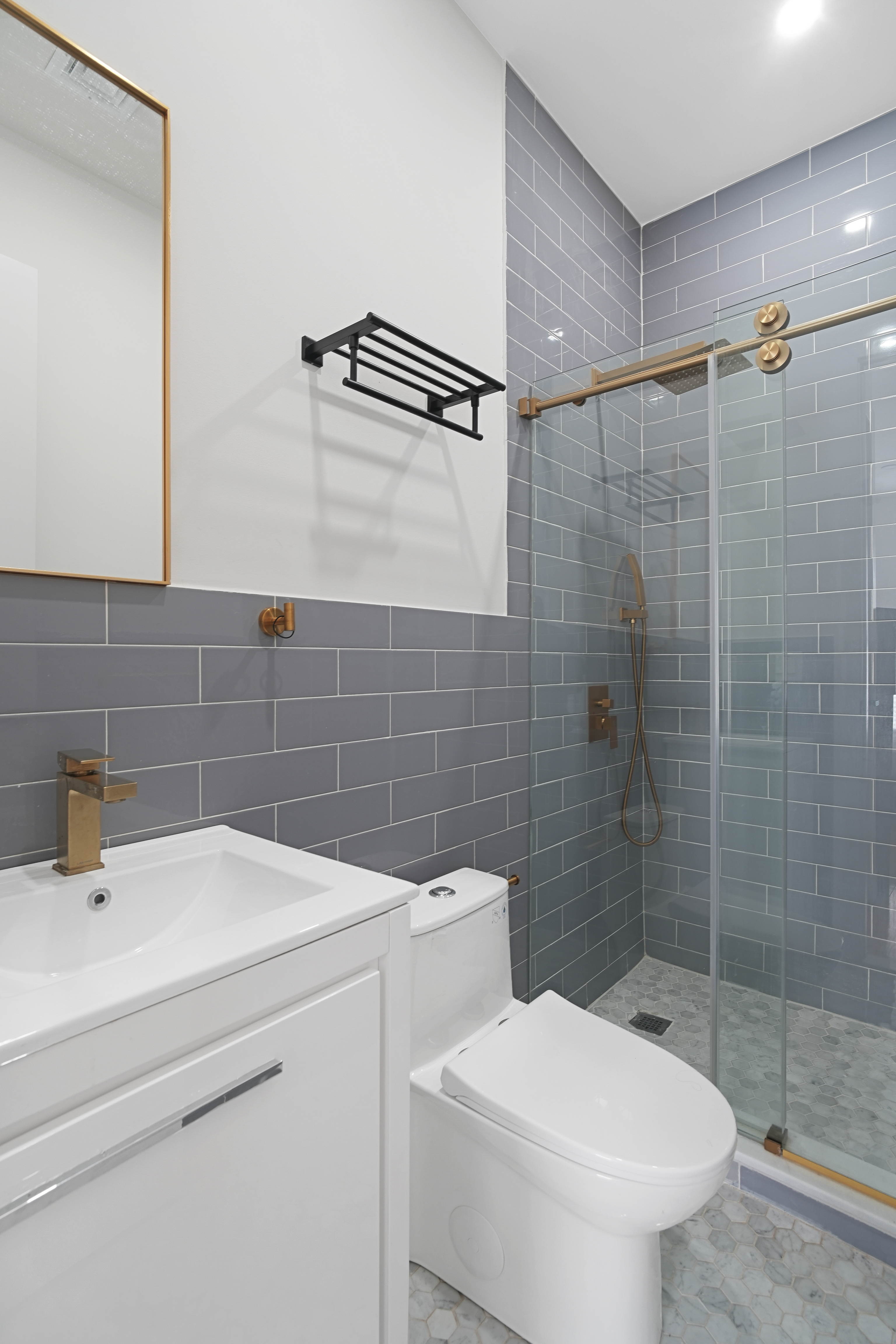 1390 Eastern Parkway Brooklyn, NY 11233 - Photo 8 of 19 a bathroom with a sink a toilet and shower